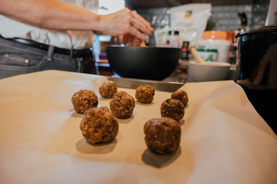 Tahini cookie dough arranged on a baking sheet